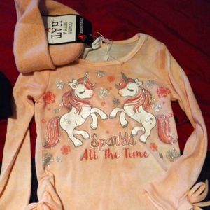 A unicorn shirt with hat